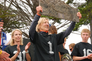 Jamie Rivers holds up her heavy trophy